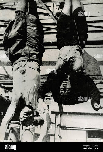 benito-mussolini-and-claretta-petacci-hanging-upside-down-in-a-gas-station-in-piazzale-loreto-milan-italy-april-28-1945-2A4A3HG