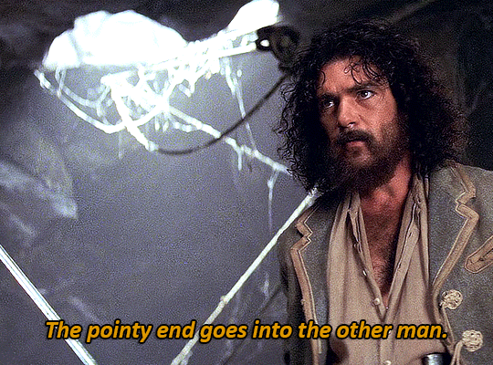 The pointy end goes into the other man.