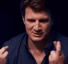 nathan-fillion-fingers-crossed